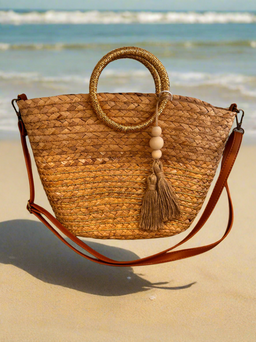 Opulent Gold handle woven straw bag
