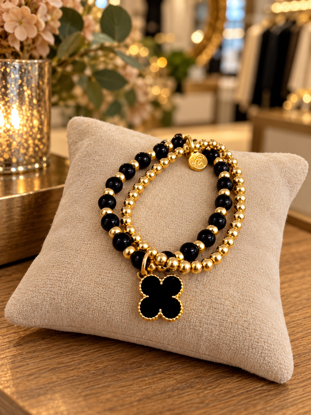 Envy layered clover bracelet in black and gold