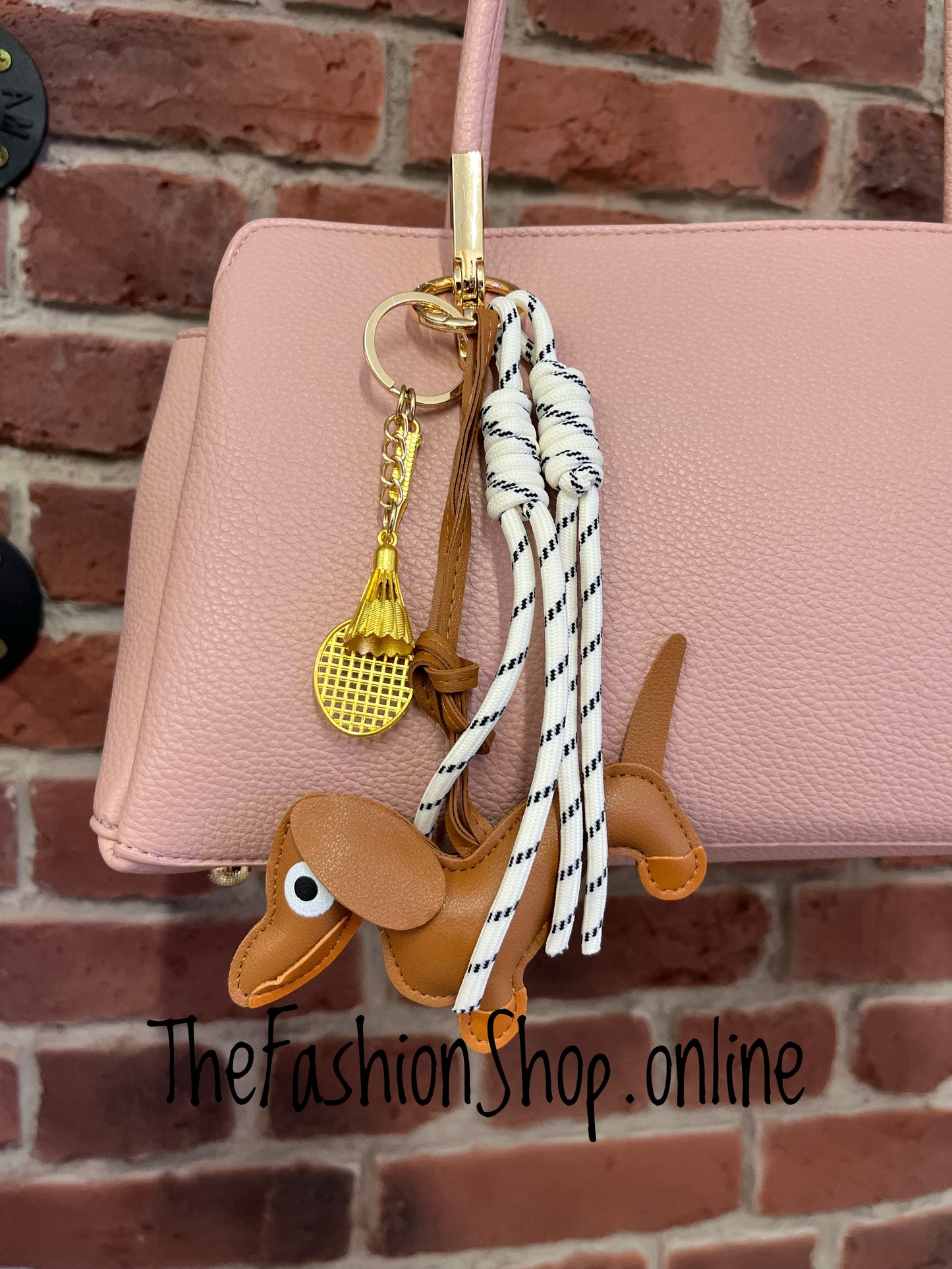 Skyla pink shoulder bag with dachshund charm