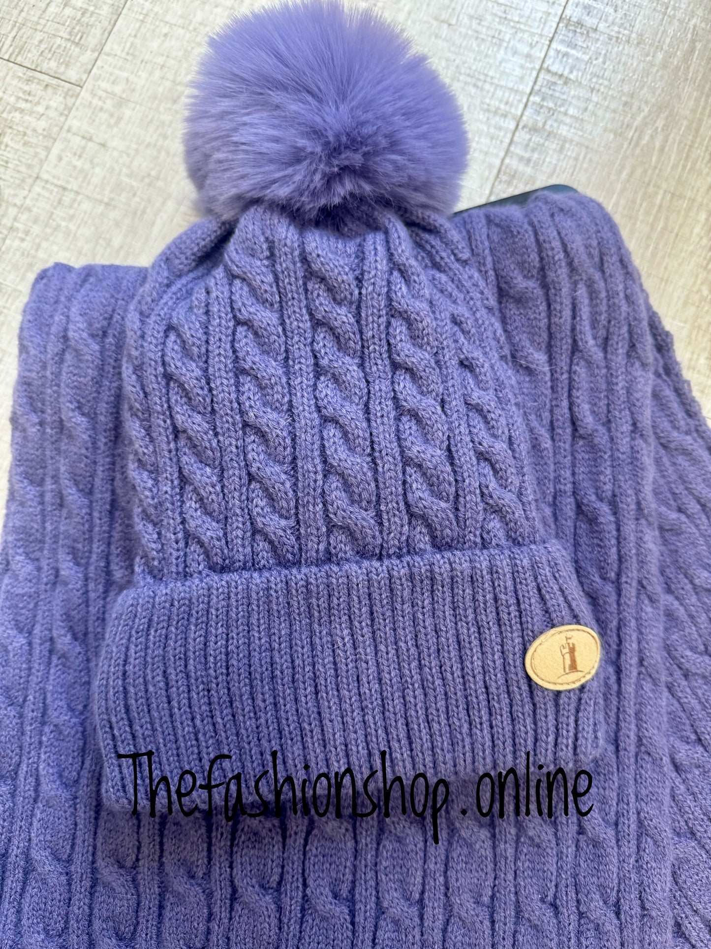 Huddy's purple cable knit hat and scarf set