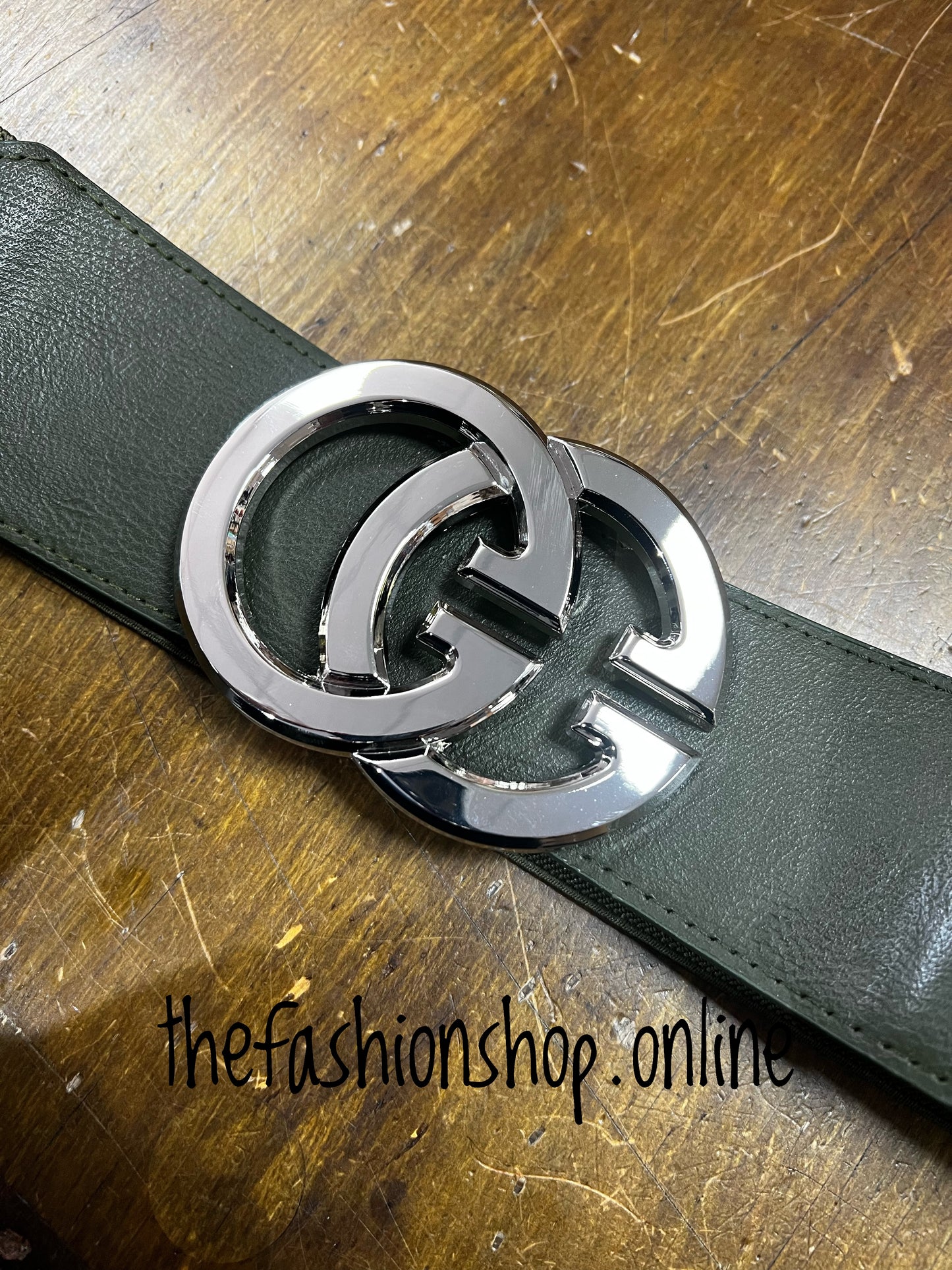 Khaki elasticated belt with silver logo buckle