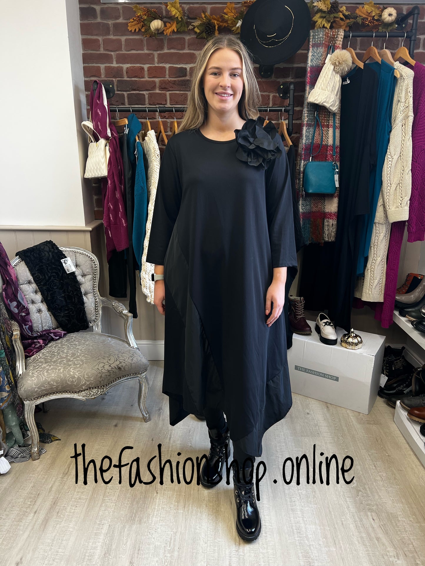 Black panel dress with flower brooch 10-18