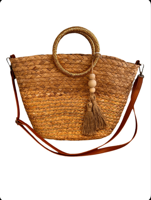 Opulent Gold handle woven straw bag