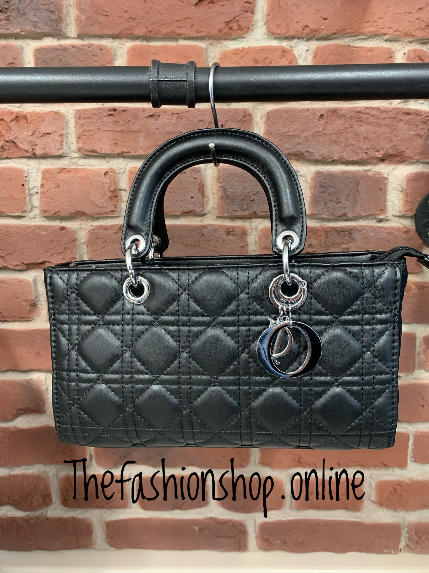 Black quilted oblong bag