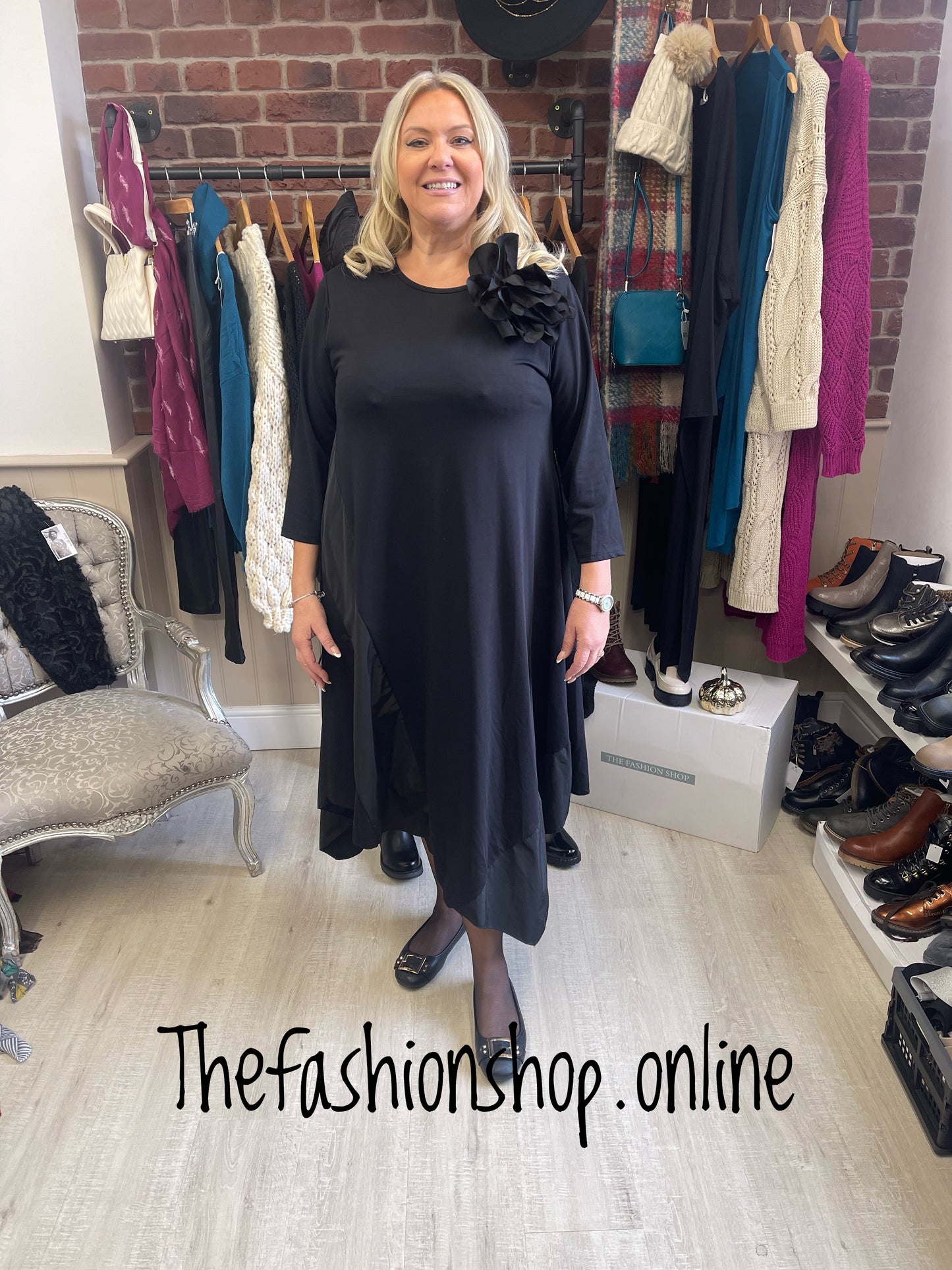 Black panel dress with flower brooch 10-18