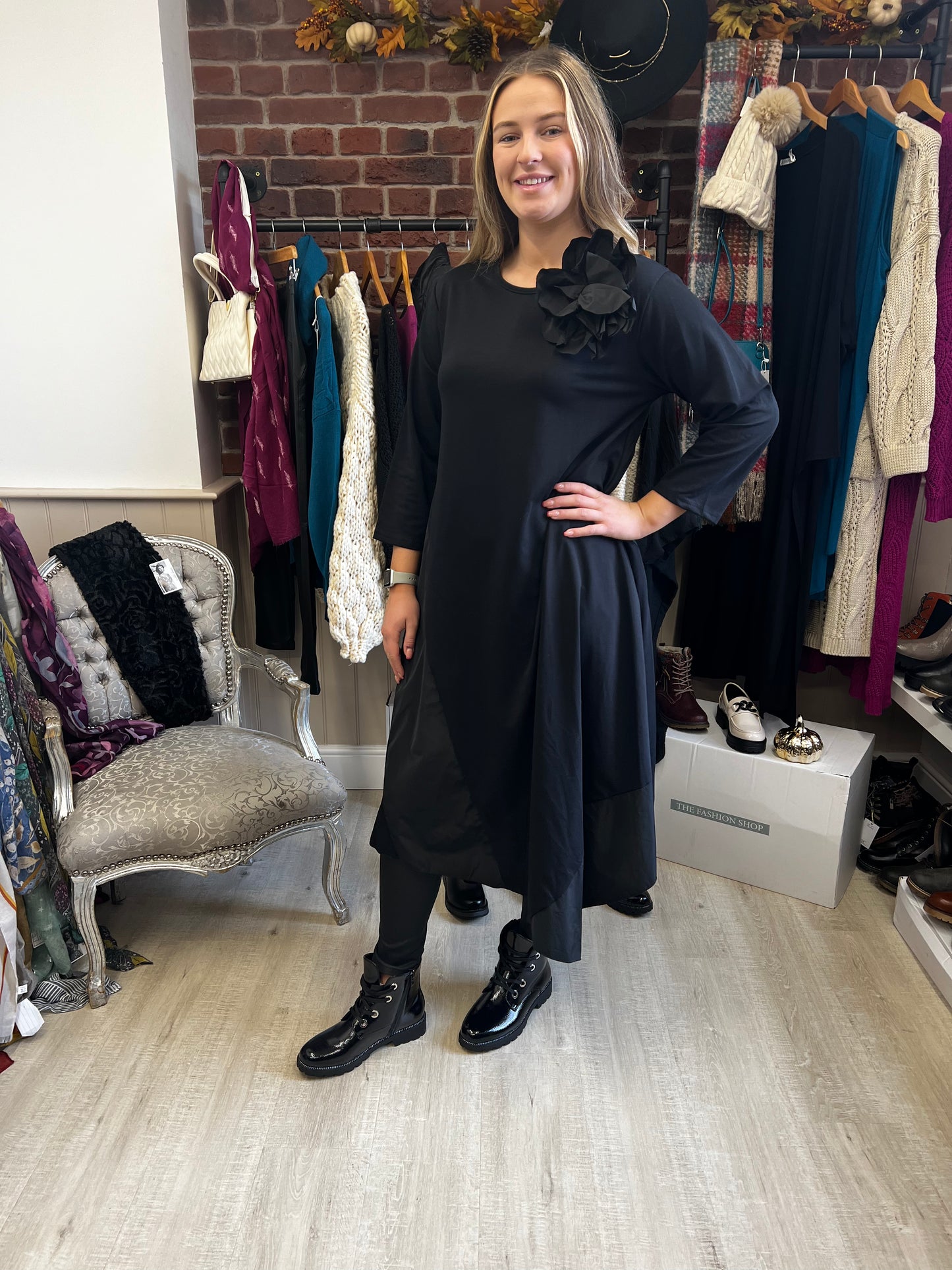 Black panel dress with flower brooch 10-18