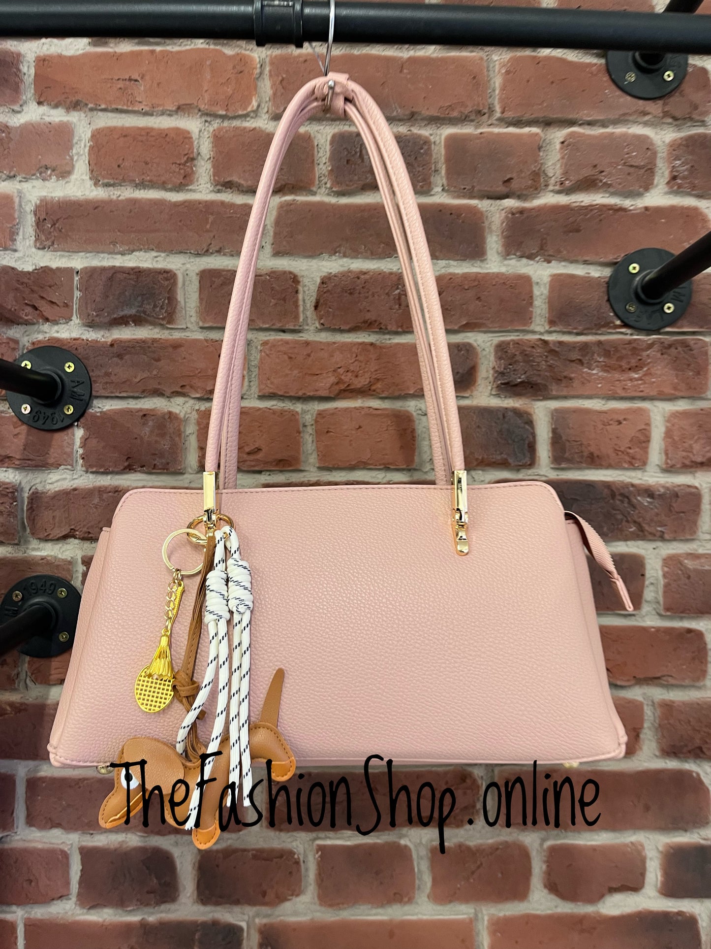 Skyla pink shoulder bag with dachshund charm