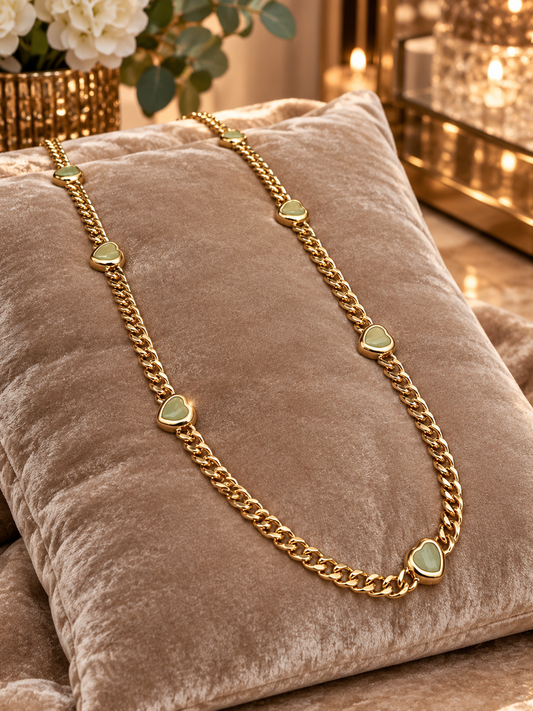 Envy long gold curb necklace with small pale green hearts
