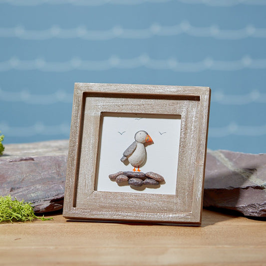 Pebble puffin on rocks framed wooden plaque