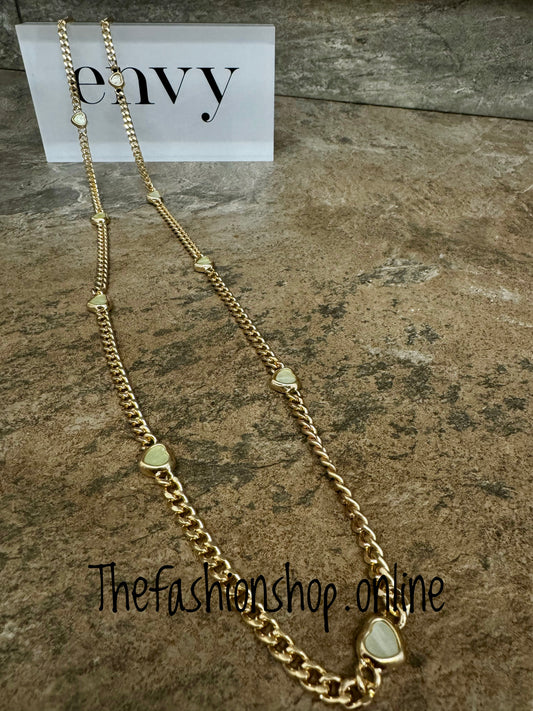 Envy long gold curb necklace with small pale green hearts