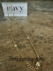 Envy long gold curb necklace with small pale green hearts