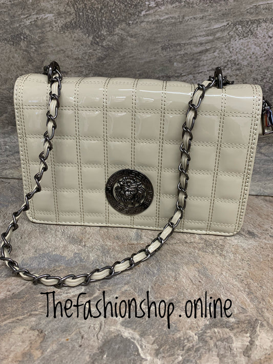 Beige designer inspired patent stitch bag