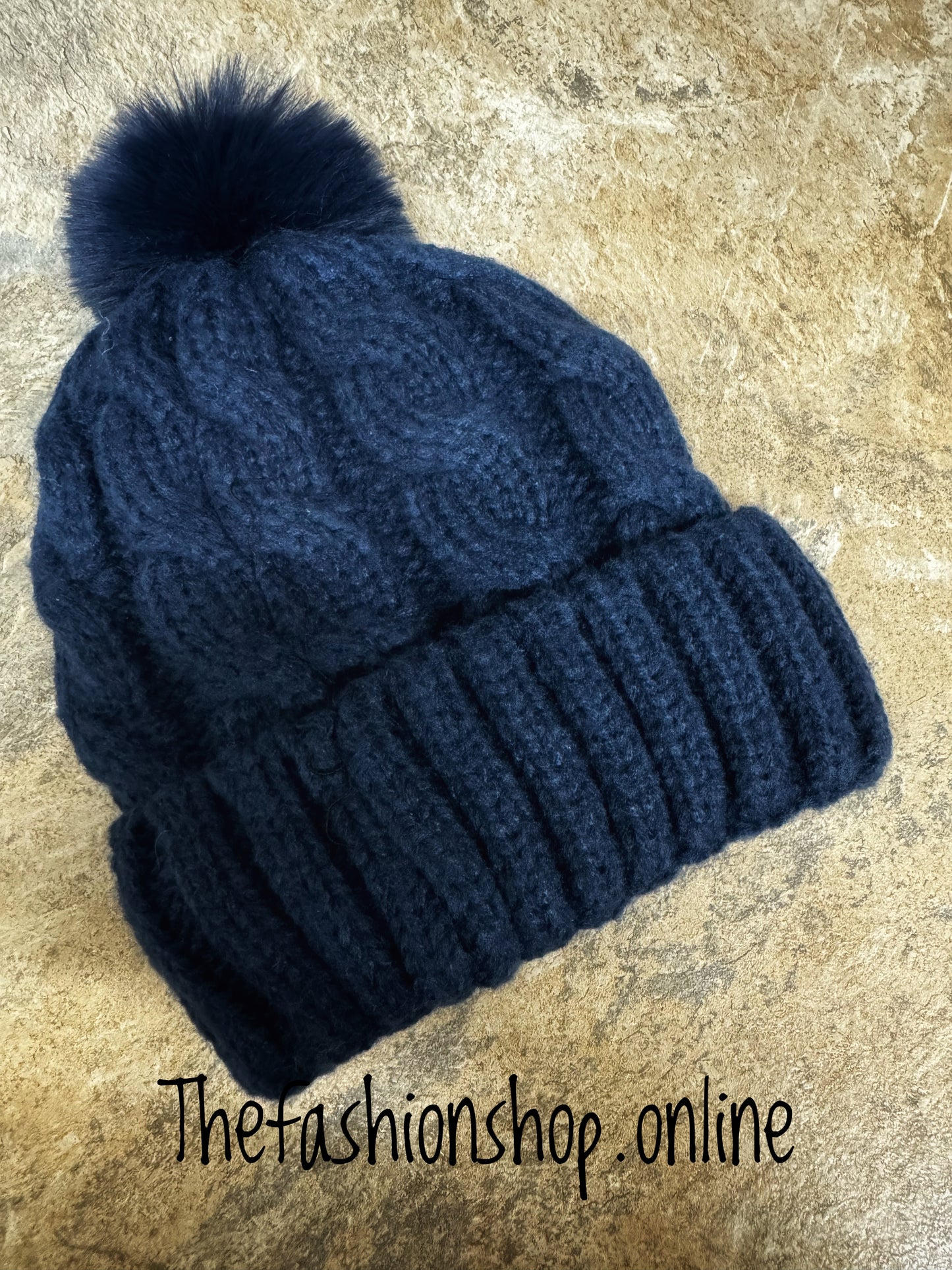 Navy blue cable fleece lined pompom hat
