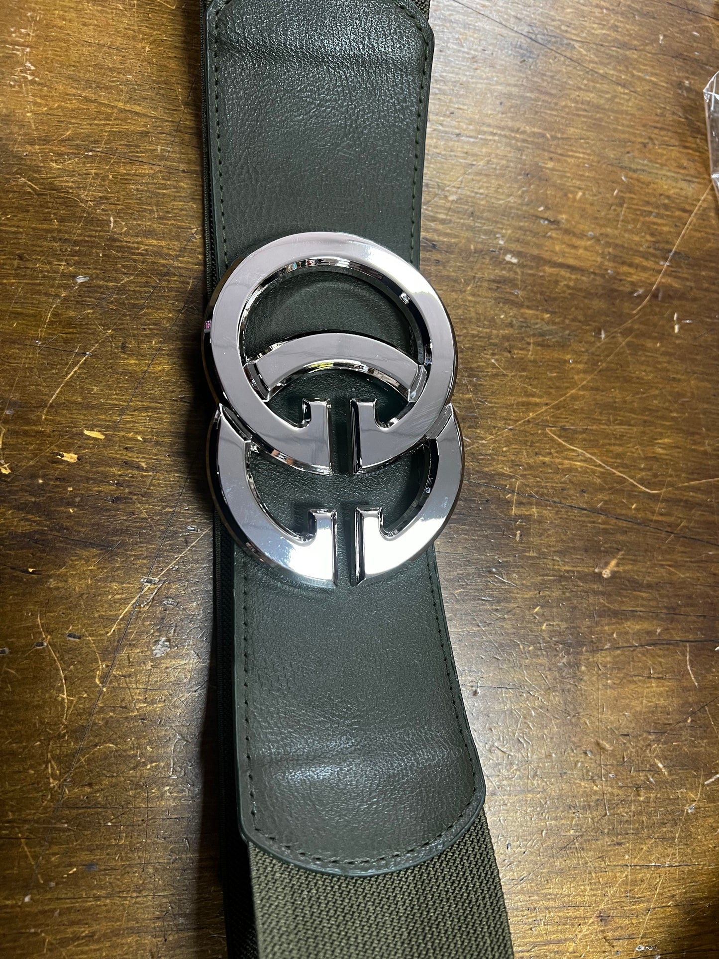 Khaki elasticated belt with silver logo buckle