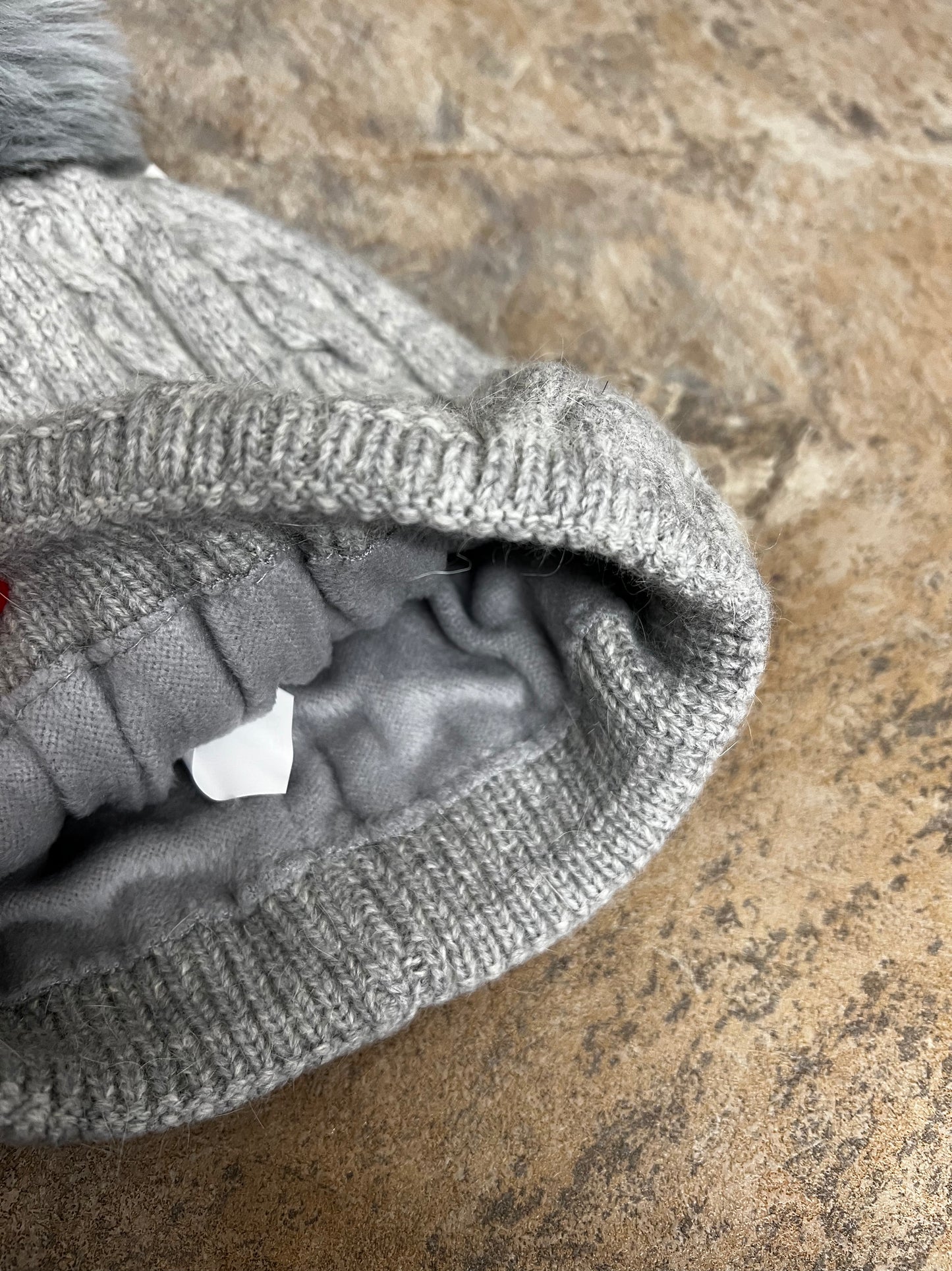 Light grey cable knit pompom hat