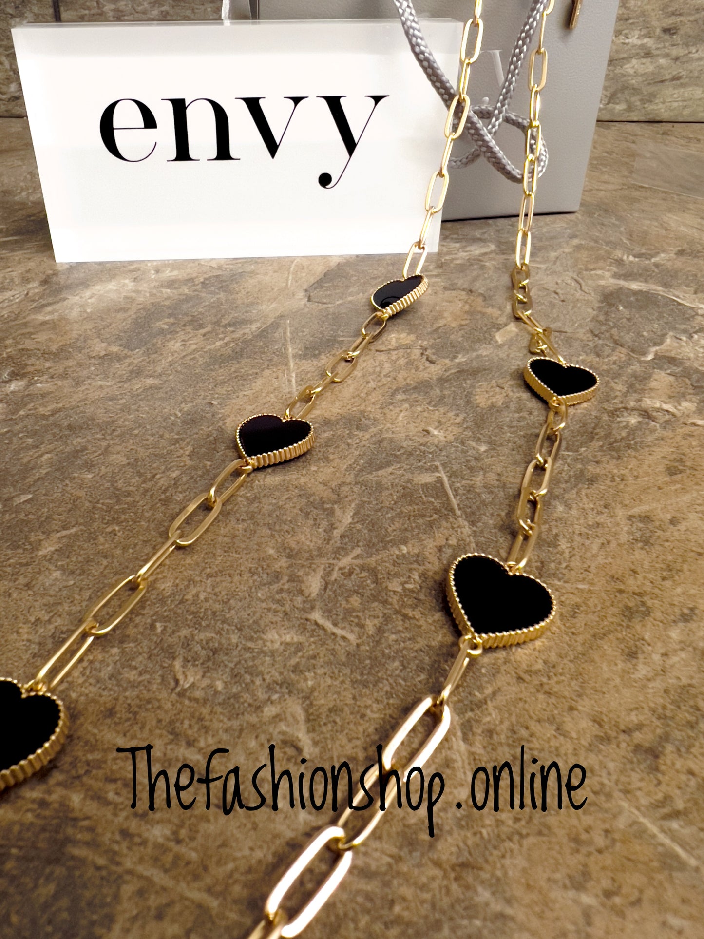 Envy long gold necklace with black hearts