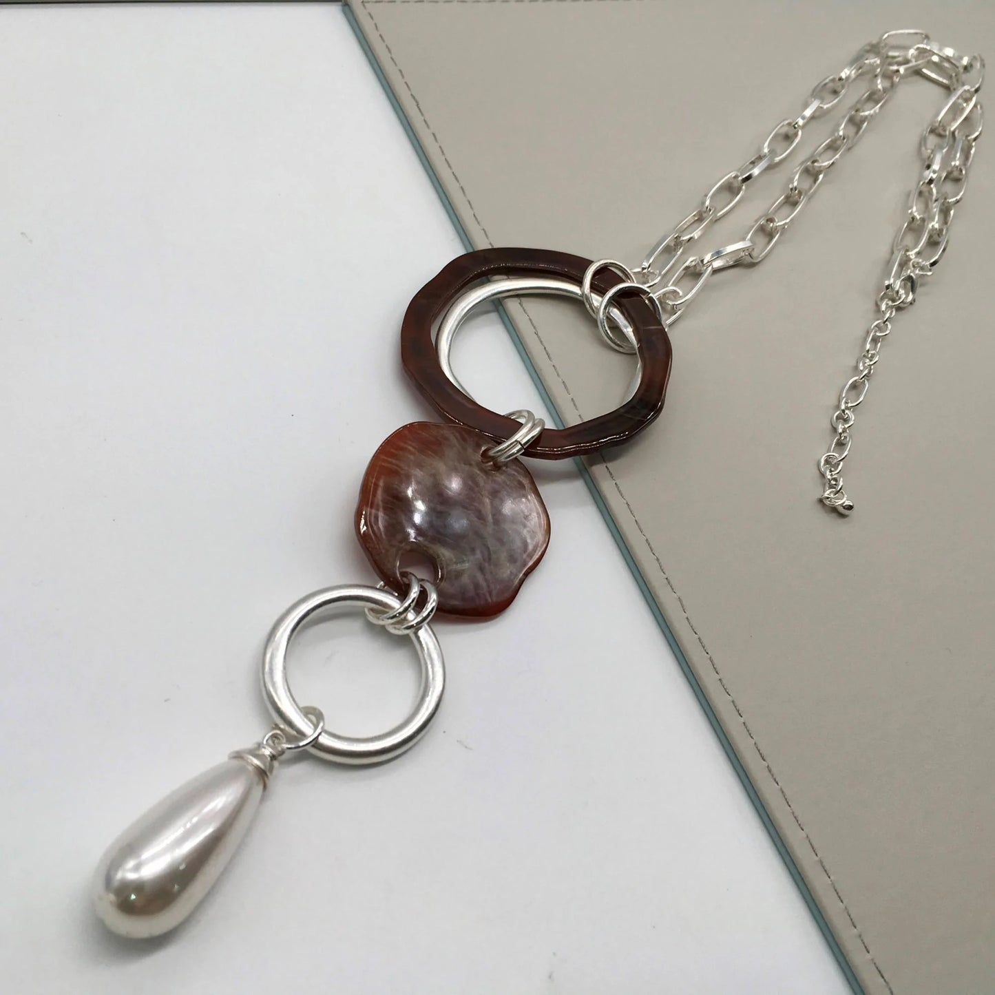 Silver and brown links and circles necklaces