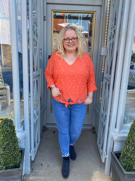 Orange raised flower tie detail blouse