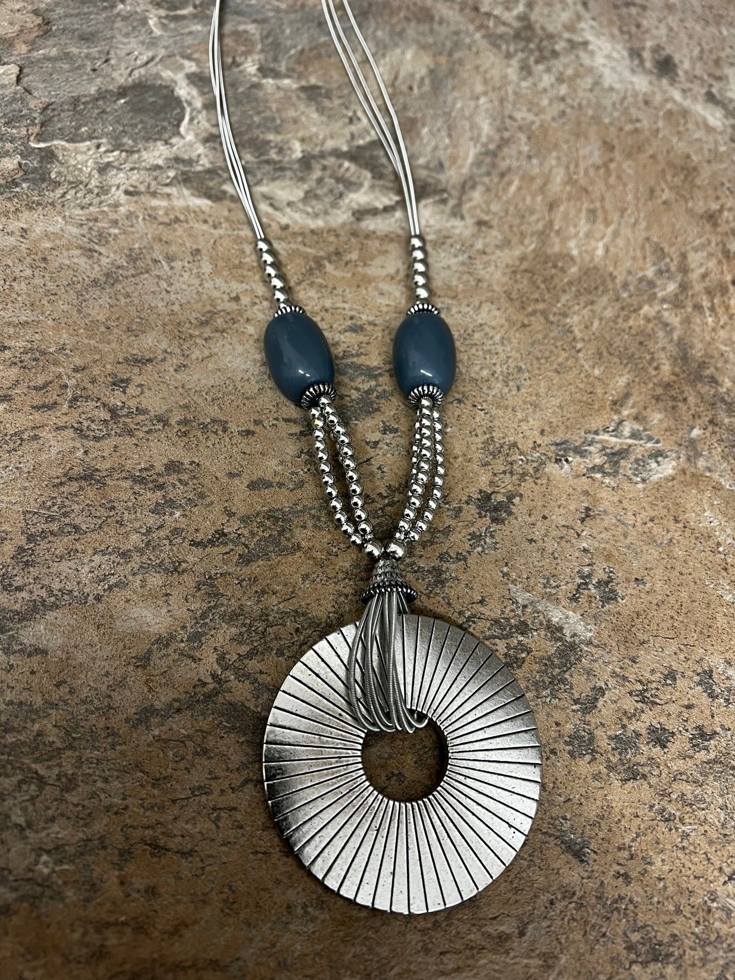 Grey bead and silver sundial necklace