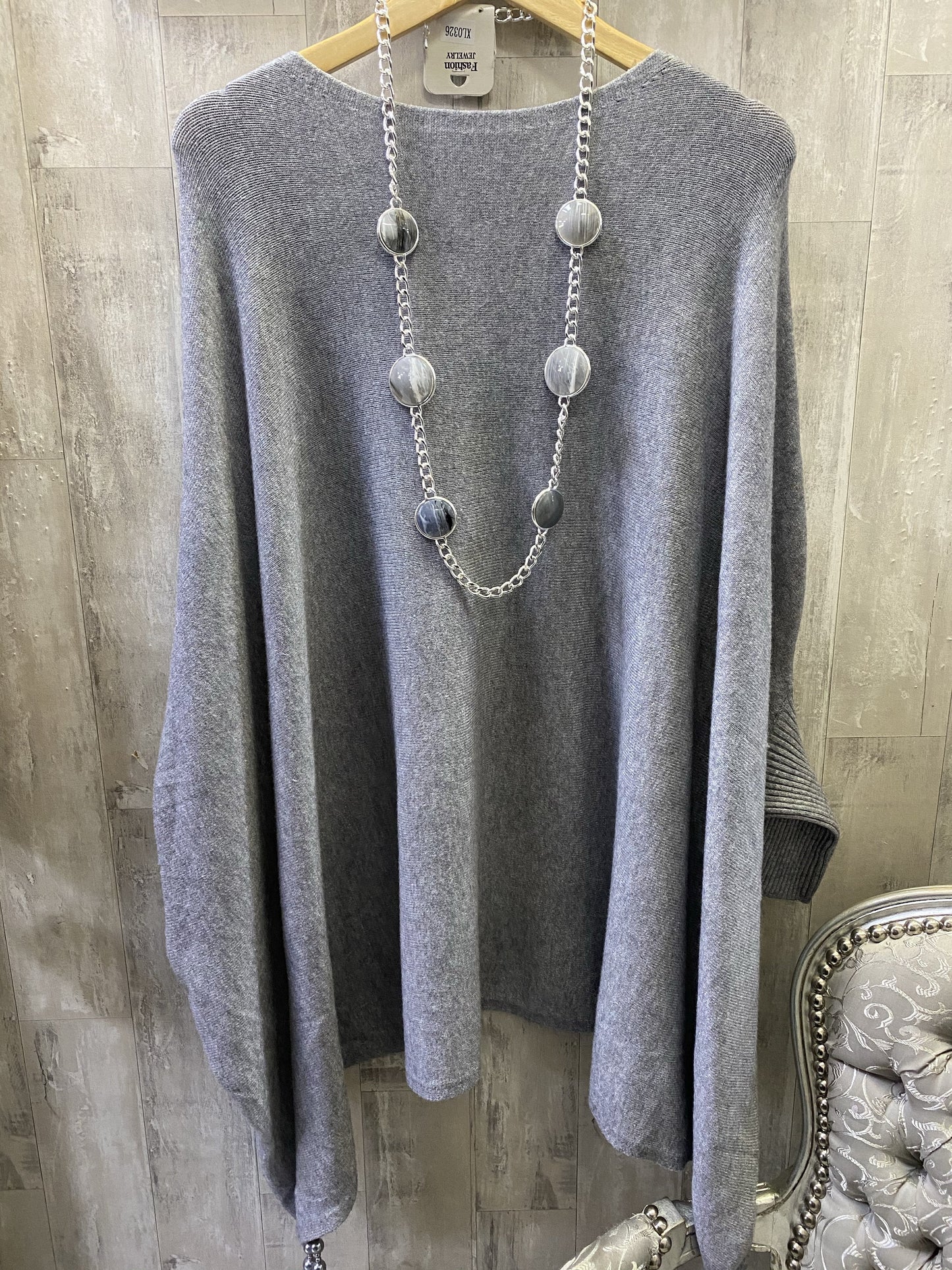 Grey poncho with sleeves in